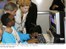 Presidente Lula e a ministra do Turismo, Marta Suplicy, visitam sala de inclusão digital para portadores de necessidades especiais localizada na Vila do Pan.
